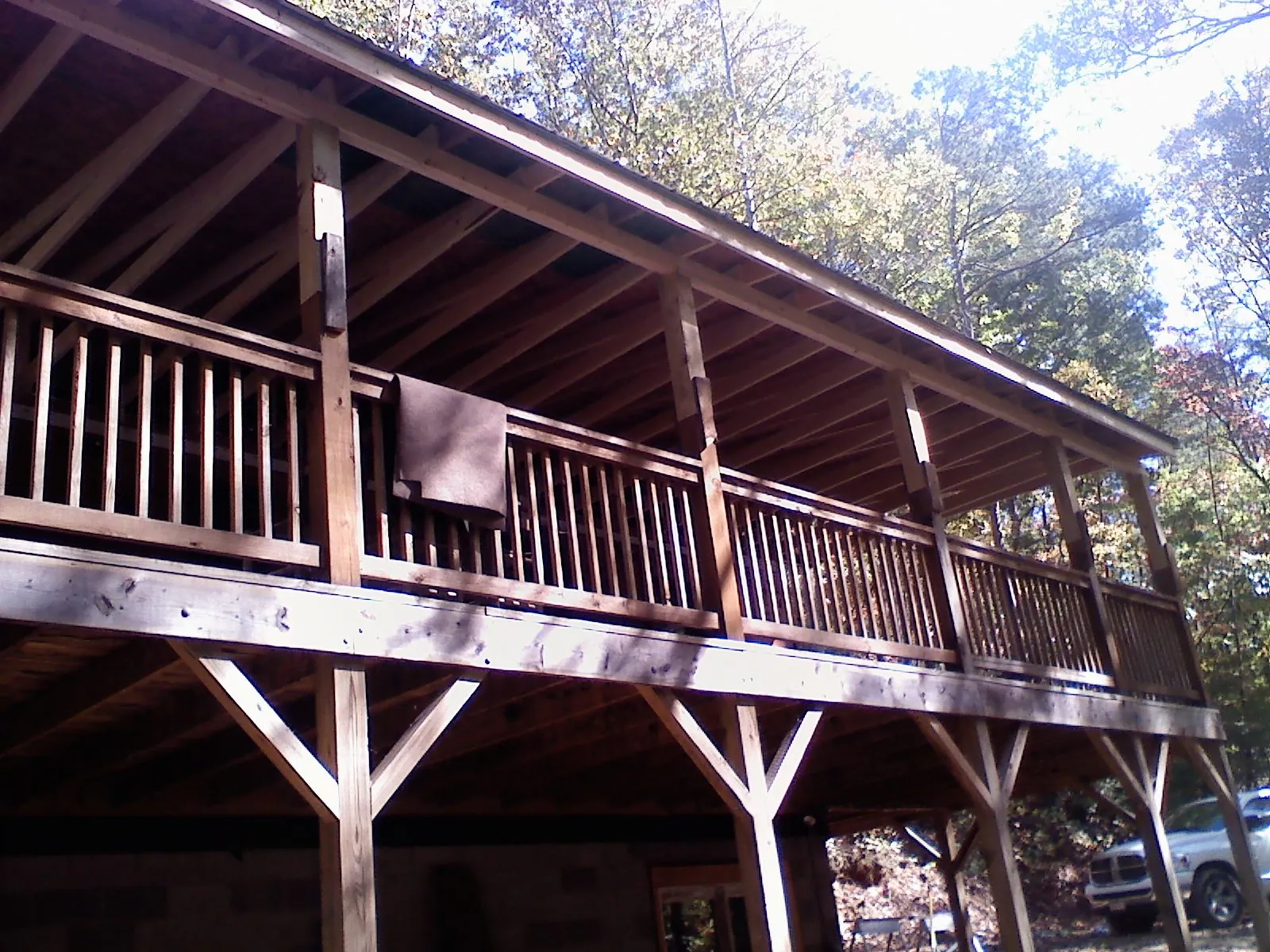 Timber framing under a new elevated porch and deck — Roof Leak Repair in Roundup by Roofing Brothers
